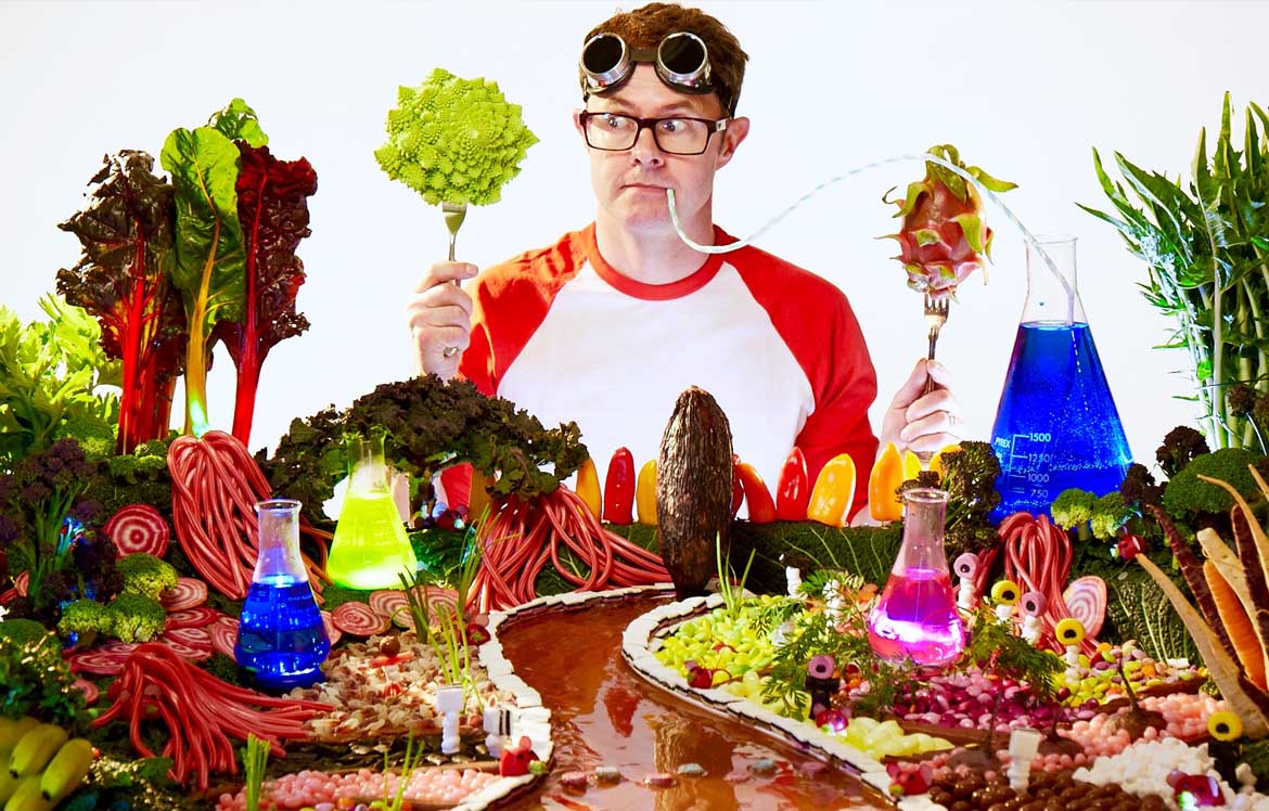 A man surrounded by different foods