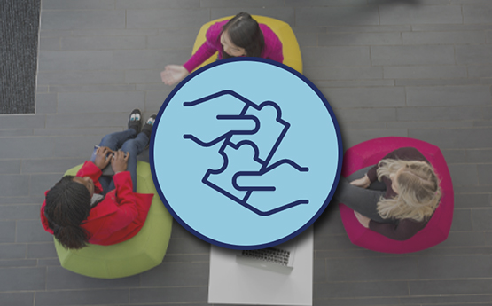 A picture of hands putting puzzle pieces together