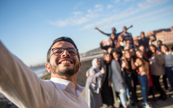 International students taking a selfie photo.