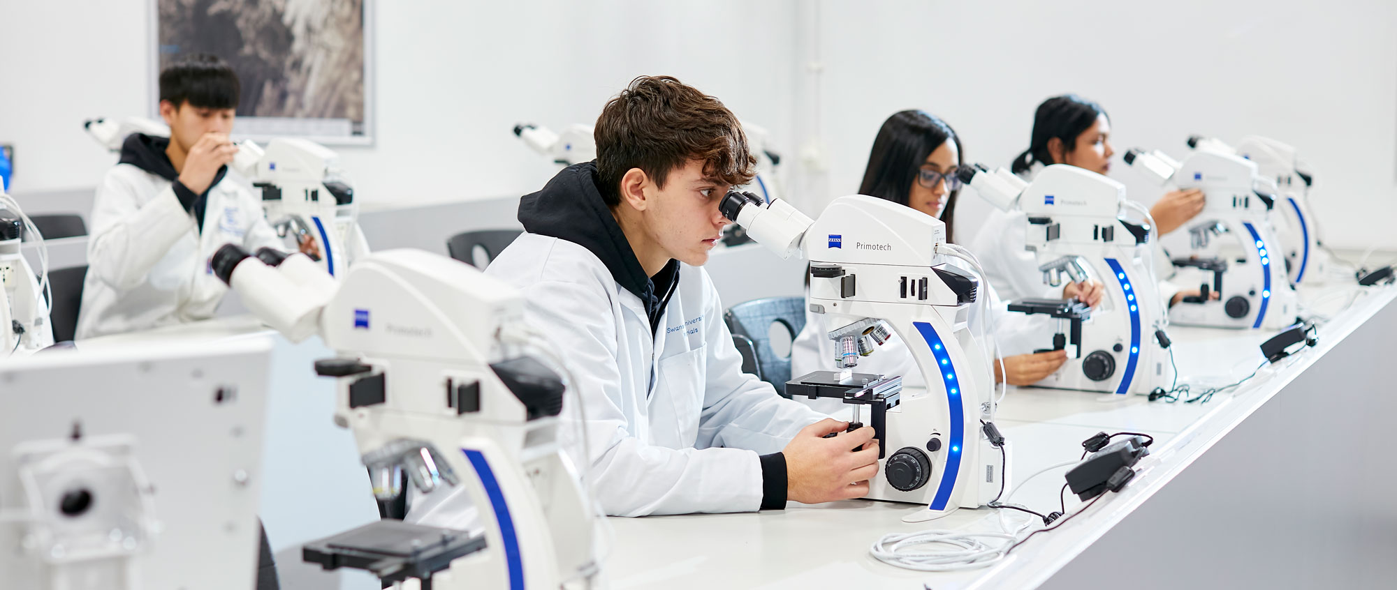Students in lab with microscopes