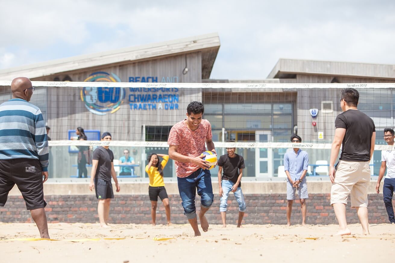International students playing Beach volleyball