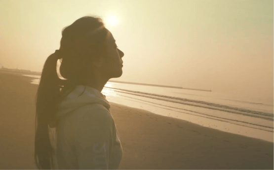 A student on Swansea beach.