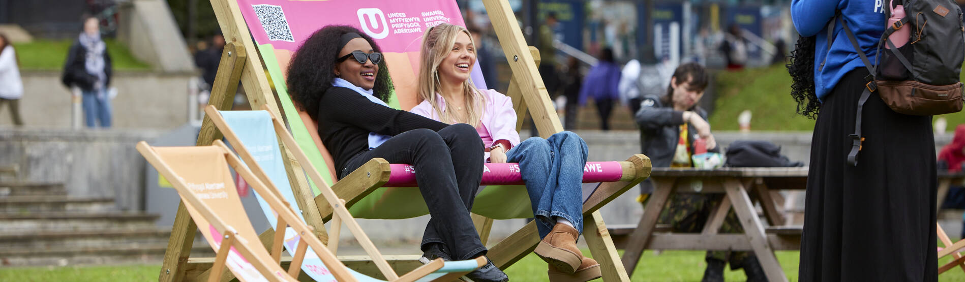 Students on a giant deck chair at open day