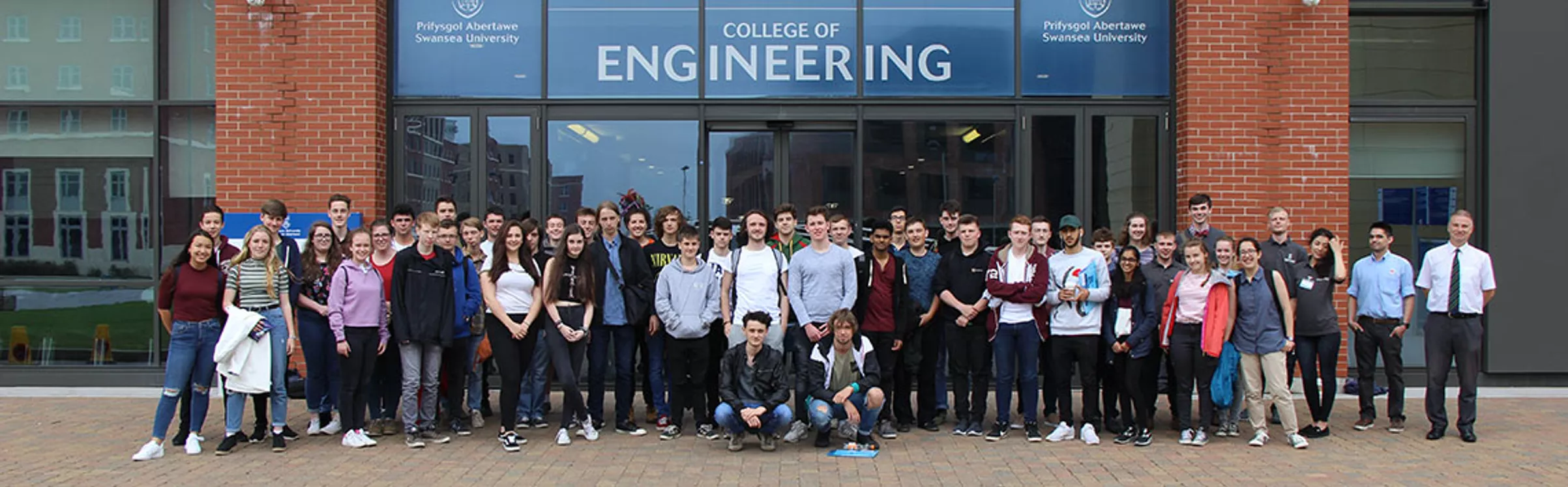 Summer School students standing outside the College of Engineering
