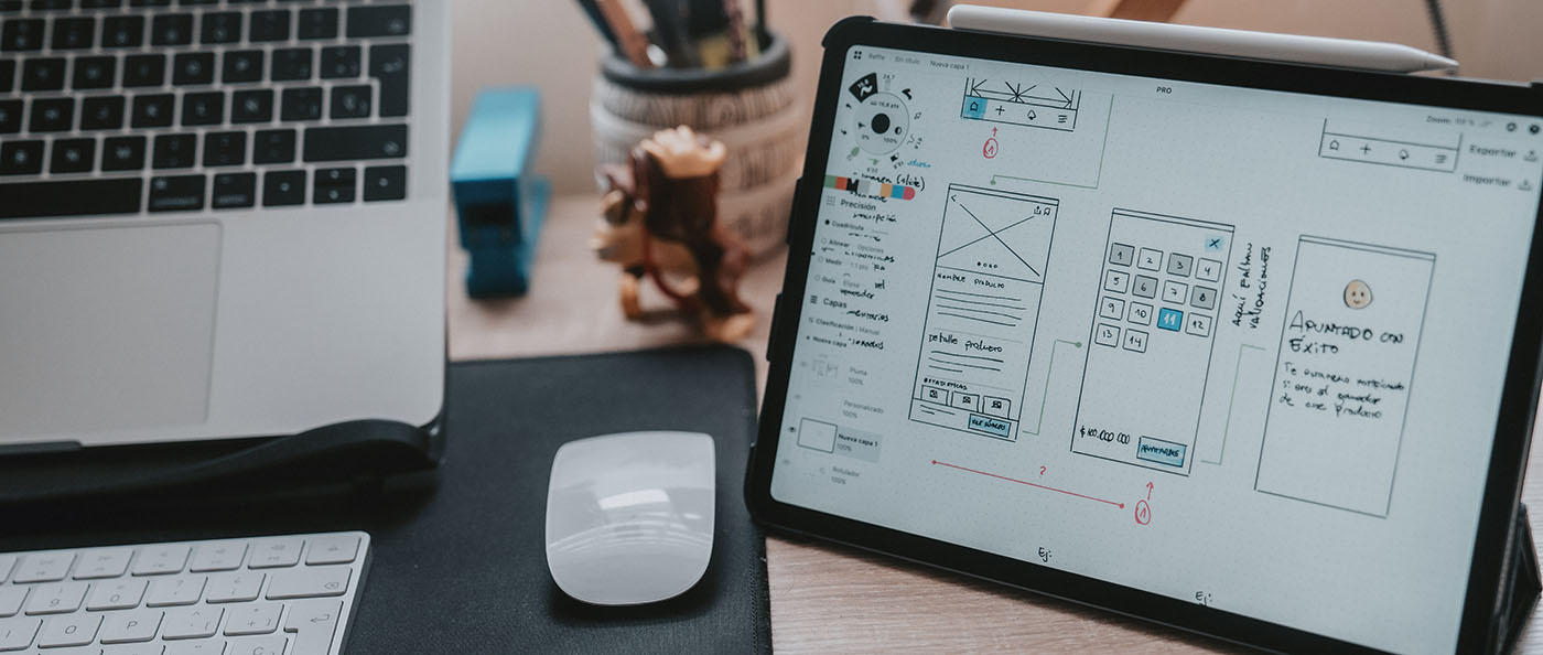 a mum looking after baby while working on laptop