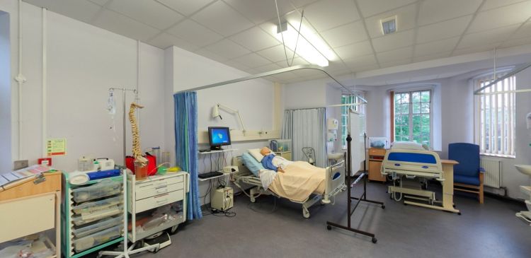 Clinical practice suite with hospital beds, mannequins and medical equipment
