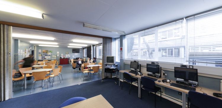 Student resource room with computers, study tables and seating area