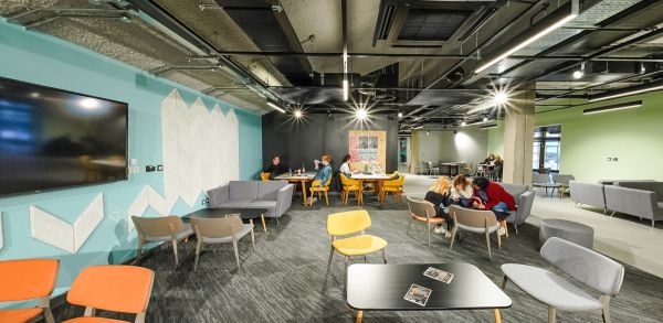 Students studying and collaborating in a modern social learning space