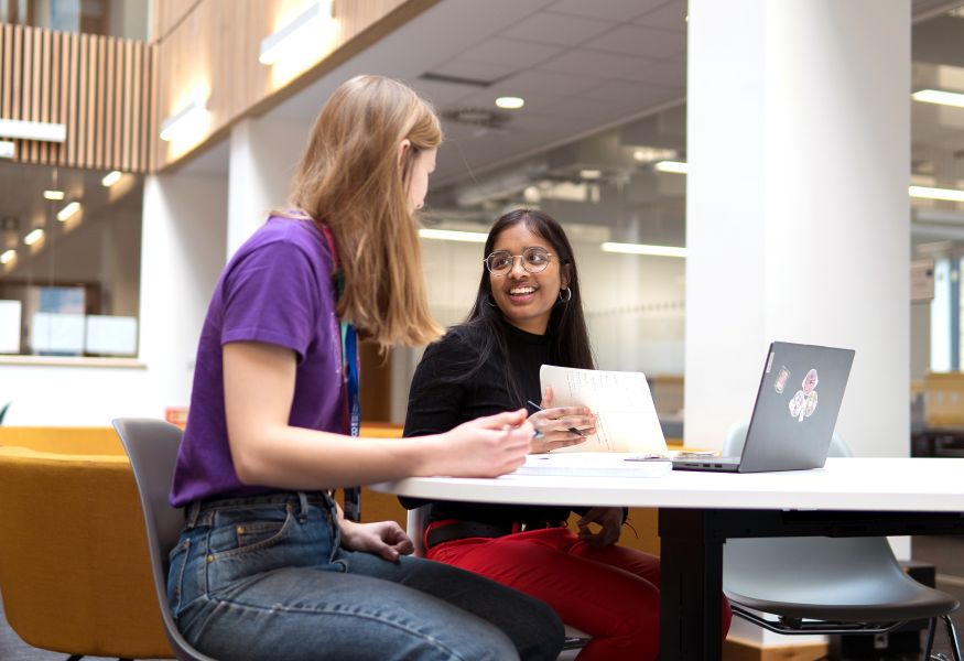 Students chatting at a table