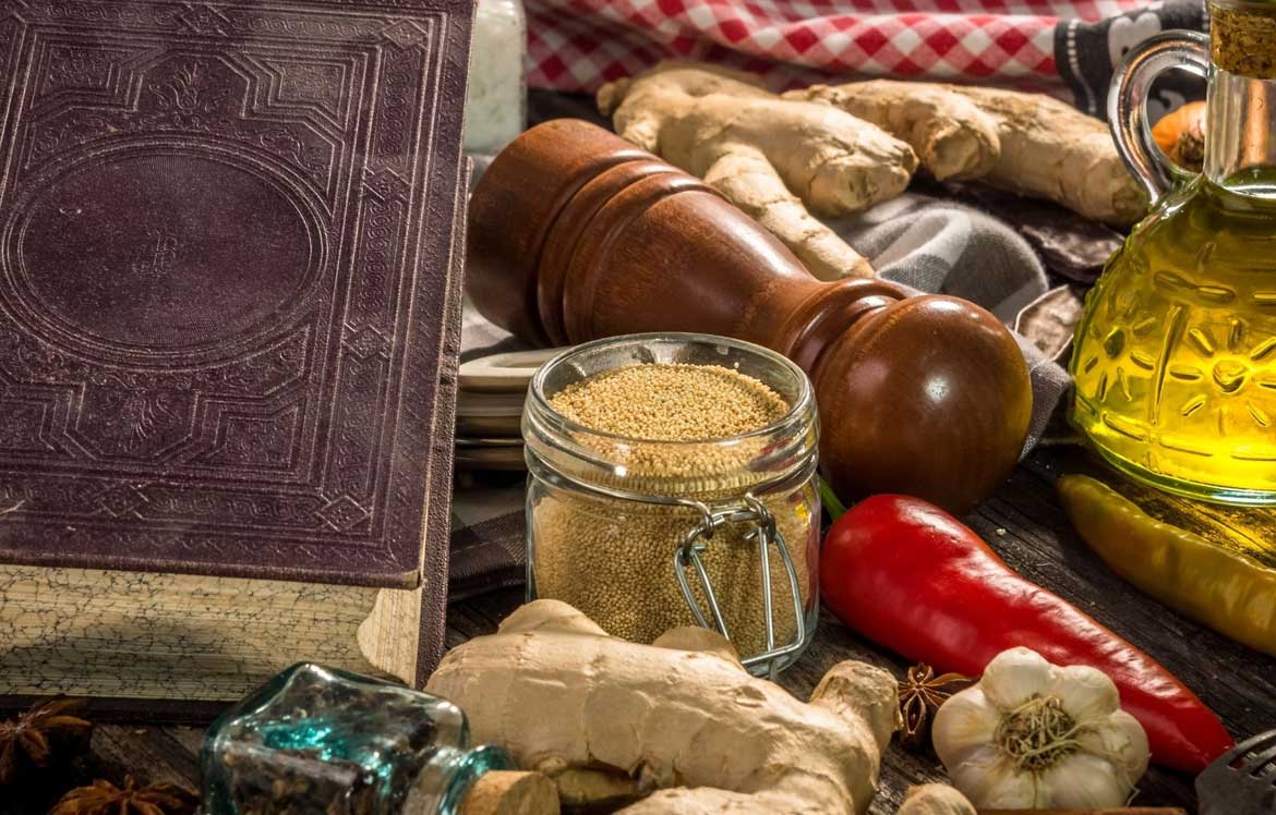 herbs, spices, peppers and a cookery book