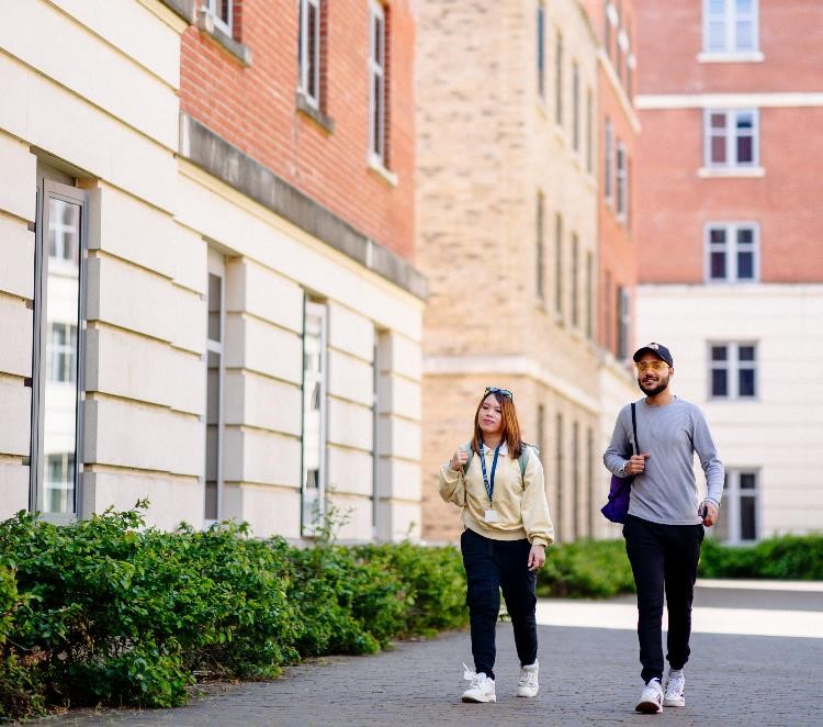 Students walking through Swansea university accommodation.